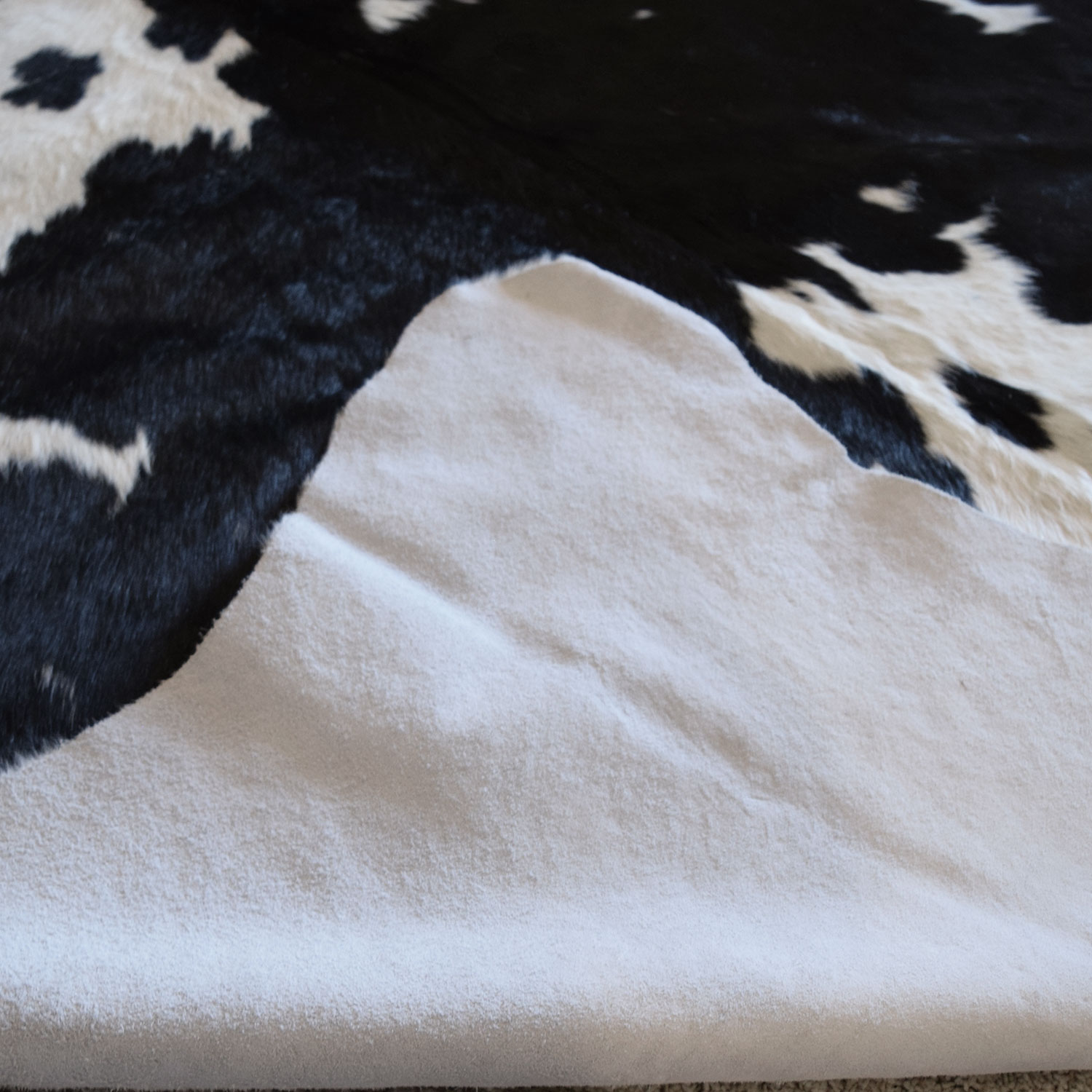 322202XL-1 - 93in L x 85in W Genuine Black and White Grade-B Cowhide