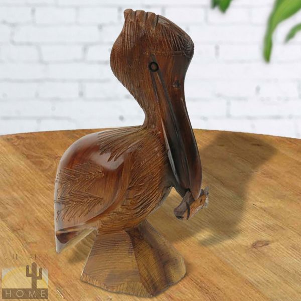 172239 - 6-7in Tall Pelican with Fish Ironwood Carving